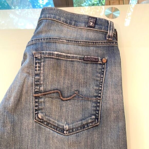 7 for all mankind, jeans, blue wash 33 distressed on the bottom of both legs